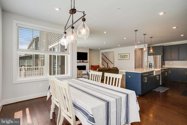 Dining room, Fireplace, Interior, Kitchen, Pendant Lights, Recessed Lighting, Stainless Steel Appliances, Wood Texture Flooring