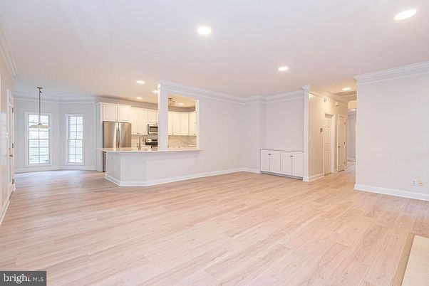 Empty room, Interior, Kitchen, Pendant Lights, Recessed Lighting, Stainless Steel Appliances, Wood Texture Flooring