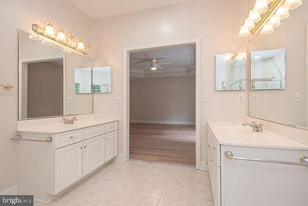 Bathroom, Dual Sink Vanities, Interior, Marble, Recessed Lighting, Wood Texture Flooring