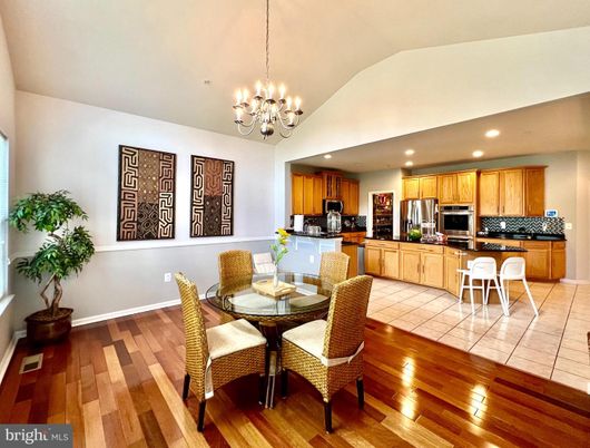 Chandelier, Dining room, Interior, Kitchen, Recessed Lighting, Stainless Steel Appliances, Wood Texture Flooring