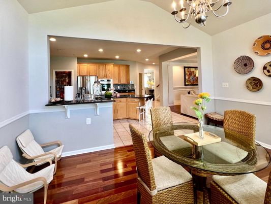 Chandelier, Dining room, Interior, Kitchen, Recessed Lighting, Stainless Steel Appliances, Wood Texture Flooring