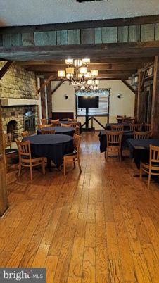 Chandelier, Dining room, Fireplace, Interior, Stone Walls, Wooden Beams, Wooden Ceilings, Wood Texture Flooring
