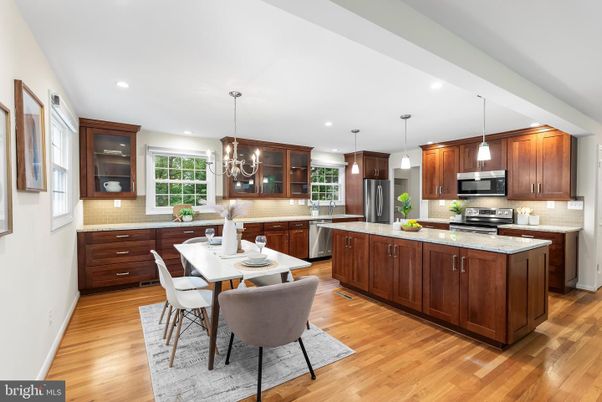 Chandelier, Dining room, Interior, Kitchen, Pendant Lights, Recessed Lighting, Stainless Steel Appliances, Wood Texture Flooring