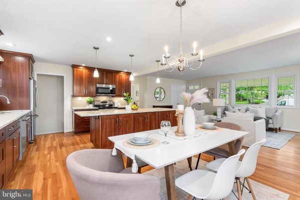 Chandelier, Dining room, Interior, Kitchen, Living room, Pendant Lights, Recessed Lighting, Stainless Steel Appliances, Wood Texture Flooring