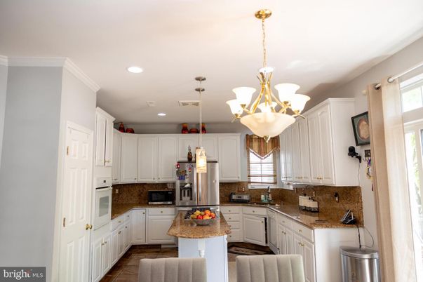 Chandelier, Interior, Kitchen, Pendant Lights, Recessed Lighting, Stainless Steel Appliances, Wood Texture Flooring