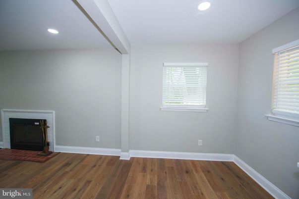 Empty room, Fireplace, Interior, Recessed Lighting, Wood Texture Flooring