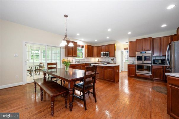 Dining room, Interior, Kitchen, Pendant Lights, Recessed Lighting, Stainless Steel Appliances, Wood Texture Flooring