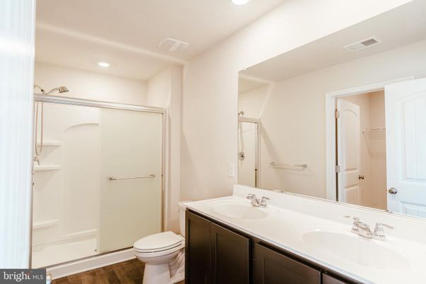 Bathroom, Dual Sink Vanities, Interior, Recessed Lighting, Wood Texture Flooring