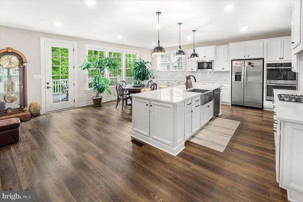 Dining room, Interior, Kitchen, Pendant Lights, Recessed Lighting, Stainless Steel Appliances, Wood Texture Flooring
