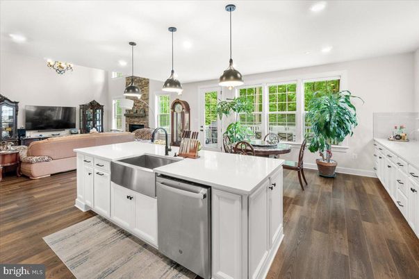 Dining room, Fireplace, Interior, Kitchen, Living room, Pendant Lights, Recessed Lighting, Stainless Steel Appliances, Wood Texture Flooring