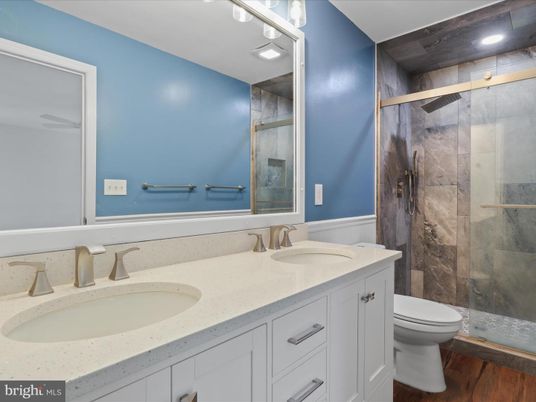 Bathroom, Dual Sink Vanities, Glass Shower, Interior, Recessed Lighting, Wood Texture Flooring