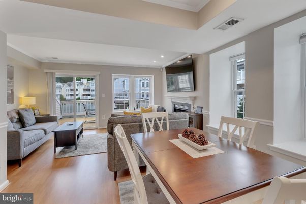 Dining room, Fireplace, Interior, Living room, Recessed Lighting, Wood Texture Flooring