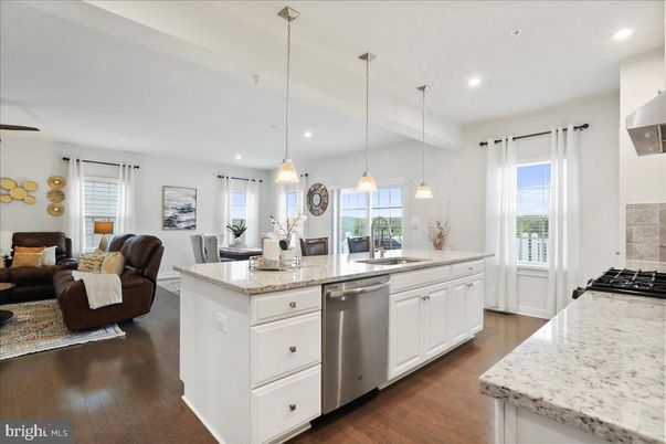Dining room, Interior, Kitchen, Living room, Pendant Lights, Recessed Lighting, Stainless Steel Appliances, Wood Texture Flooring