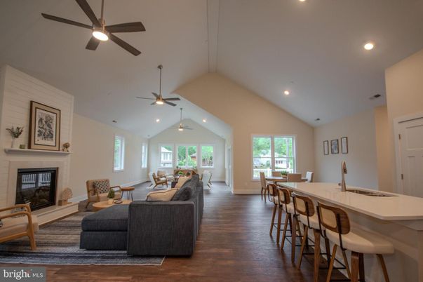 Dining room, Fireplace, Interior, Living room, Recessed Lighting, Wood Texture Flooring