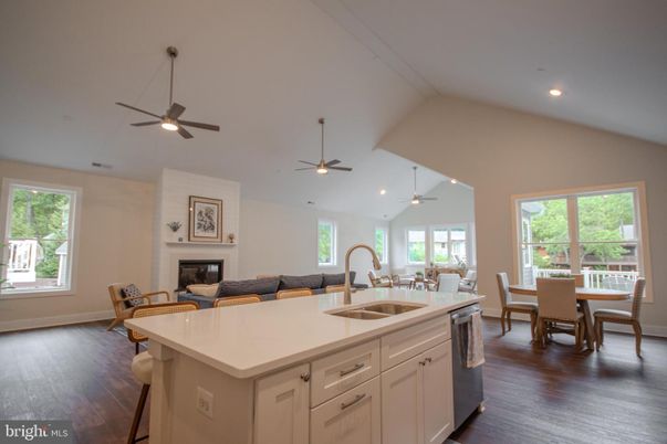 Dining room, Fireplace, Interior, Kitchen, Recessed Lighting, Wood Texture Flooring