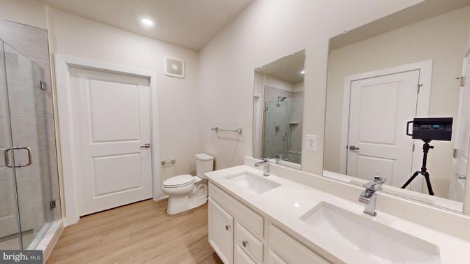 Bathroom, Dual Sink Vanities, Glass Shower, Interior, Recessed Lighting, Wood Texture Flooring