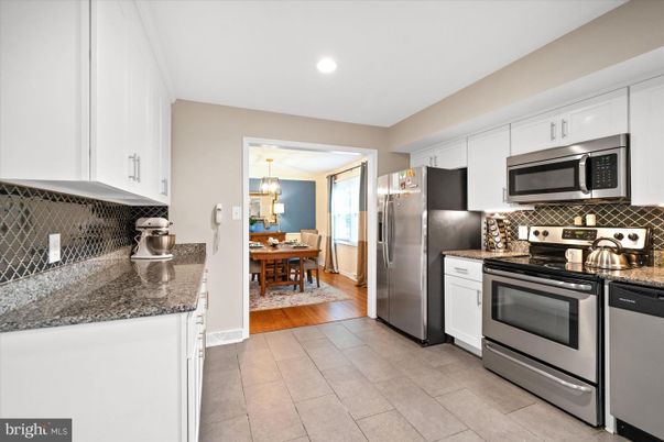 Chandelier, Dining room, Interior, Kitchen, Pendant Lights, Recessed Lighting, Stainless Steel Appliances, Wood Texture Flooring
