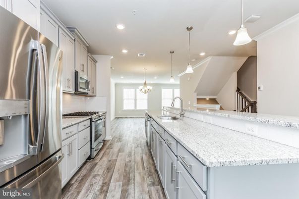 Chandelier, Interior, Kitchen, Pendant Lights, Recessed Lighting, Stainless Steel Appliances, Wood Texture Flooring