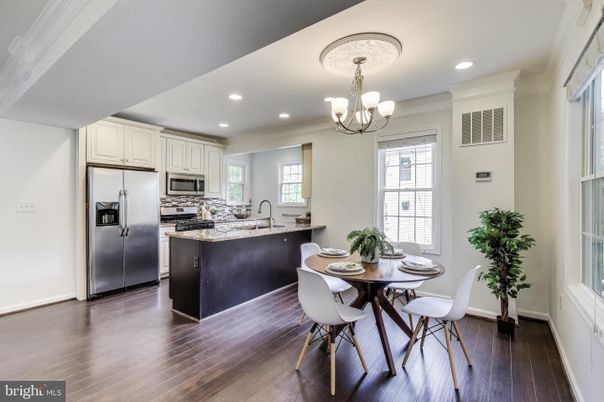 Chandelier, Dining room, Interior, Kitchen, Recessed Lighting, Stainless Steel Appliances, Wood Texture Flooring