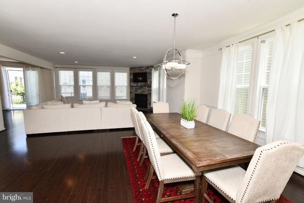 Dining room, Fireplace, Interior, Living room, Pendant Lights, Recessed Lighting, Wood Texture Flooring