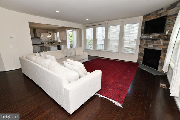 Fireplace, Interior, Kitchen, Living room, Recessed Lighting, Stone Walls, Wood Texture Flooring