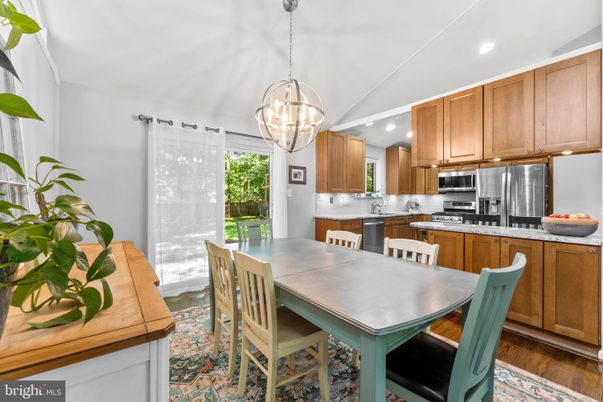 Dining room, Interior, Kitchen, Pendant Lights, Recessed Lighting, Stainless Steel Appliances, Wood Texture Flooring