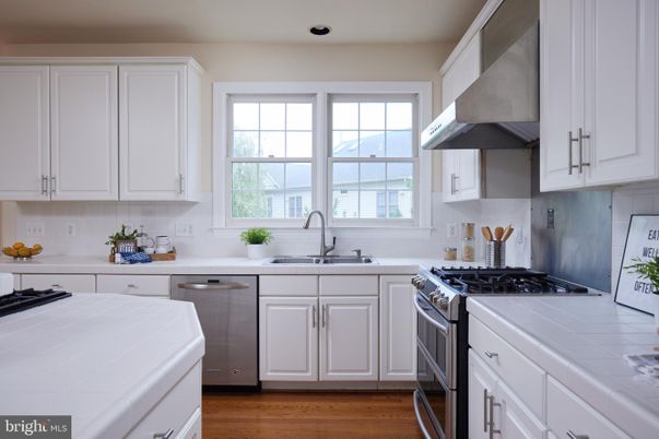 Interior, Kitchen, Recessed Lighting, Stainless Steel Appliances, Tile Countertops, Wood Texture Flooring