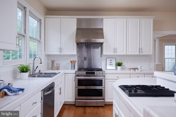 Interior, Kitchen, Stainless Steel Appliances, Tile Countertops, Wood Texture Flooring
