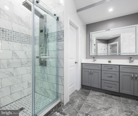 Bathroom, Dual Sink Vanities, Glass Shower, Interior, Marble Walls, Recessed Lighting