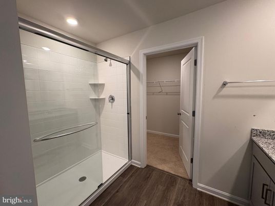 Bathroom, Glass Shower, Interior, Recessed Lighting, Walk-in Closets, Wood Texture Flooring