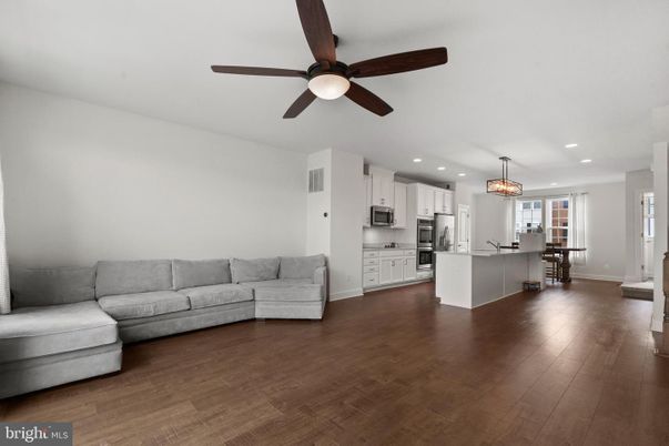 Chandelier, Dining room, Interior, Kitchen, Living room, Pendant Lights, Recessed Lighting, Stainless Steel Appliances, Wood Texture Flooring