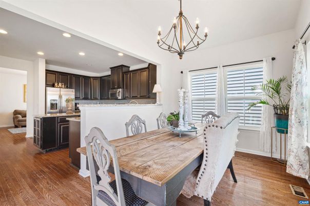 Chandelier, Dining room, Interior, Kitchen, Recessed Lighting, Stainless Steel Appliances, Wood Texture Flooring