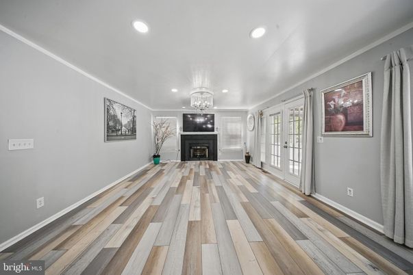 Chandelier, Empty room, Fireplace, Interior, Recessed Lighting, Wood Texture Flooring