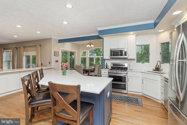 Dining room, Interior, Kitchen, Recessed Lighting, Stainless Steel Appliances, Wood Texture Flooring