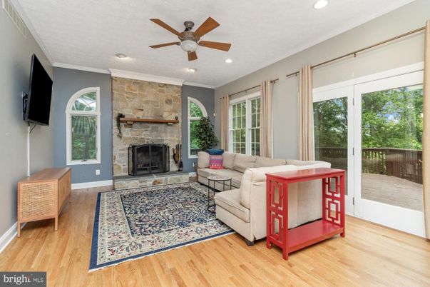 Fireplace, Interior, Living room, Recessed Lighting, Stone Walls, Wood Texture Flooring