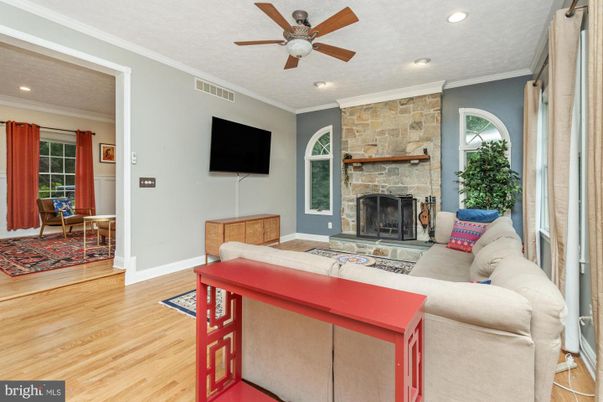 Fireplace, Interior, Living room, Recessed Lighting, Stone Walls, Wood Texture Flooring