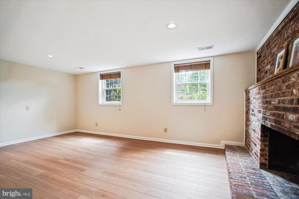 Empty room, Fireplace, Interior, Recessed Lighting, Stone Walls, Wood Texture Flooring