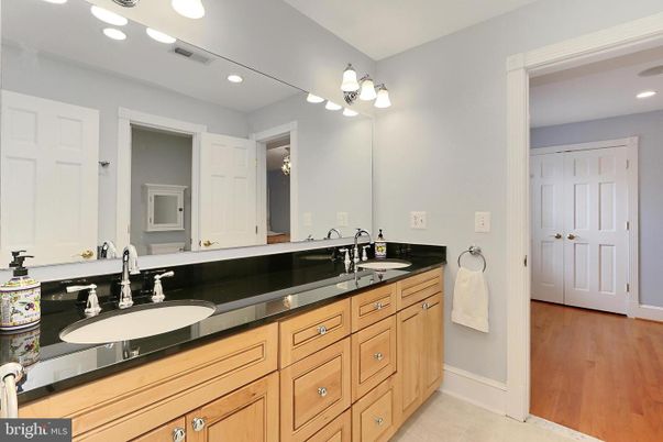 Bathroom, Dual Sink Vanities, Interior, Recessed Lighting, Wood Texture Flooring