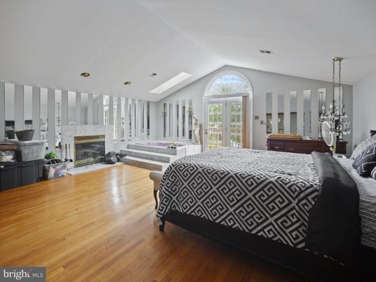 Bedroom, Fireplace, Interior, Pendant Lights, Recessed Lighting, Wood Texture Flooring