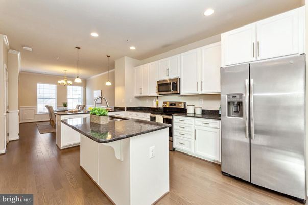 Chandelier, Dining room, Interior, Kitchen, Pendant Lights, Recessed Lighting, Stainless Steel Appliances, Wood Texture Flooring