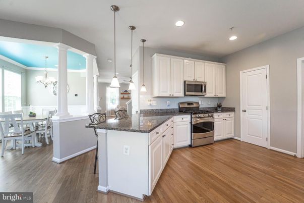 Chandelier, Dining room, Interior, Kitchen, Pendant Lights, Recessed Lighting, Stainless Steel Appliances, Wood Texture Flooring