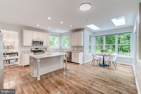 Dining room, Interior, Kitchen, Pendant Lights, Recessed Lighting, Stainless Steel Appliances, Wood Texture Flooring