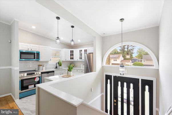 Interior, Kitchen, Marble, Pendant Lights, Recessed Lighting, Stainless Steel Appliances, Wood Texture Flooring