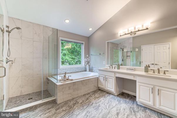 Bathroom, Dual Sink Vanities, Glass Shower, Interior, Marble, Marble Walls, Recessed Lighting