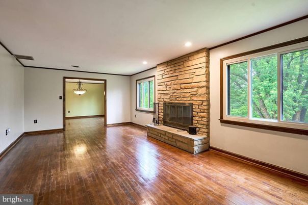 Empty room, Fireplace, Interior, Pendant Lights, Recessed Lighting, Stone Walls, Wood Texture Flooring