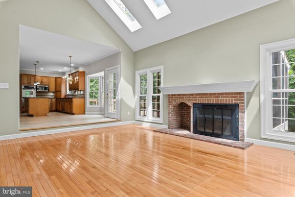 Empty room, Fireplace, Interior, Kitchen, Pendant Lights, Recessed Lighting, Wood Texture Flooring