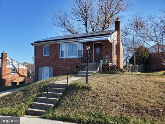 Exterior, Facade, Brick Facade, Solar Panels, Raised Ranch