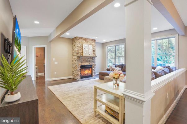 Fireplace, Interior, Living room, Recessed Lighting, Stone Walls, Wood Texture Flooring