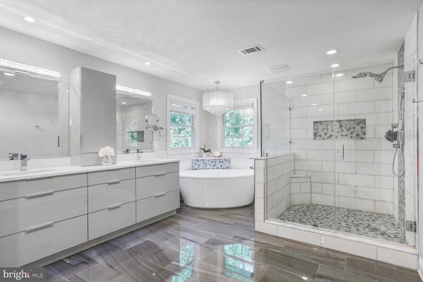 Bathroom, Chandelier, Dual Sink Vanities, Free Standing Baths, Glass Shower, Interior, Recessed Lighting, Wood Texture Flooring