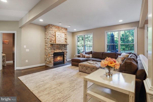 Fireplace, Interior, Living room, Recessed Lighting, Stone Walls, Wood Texture Flooring